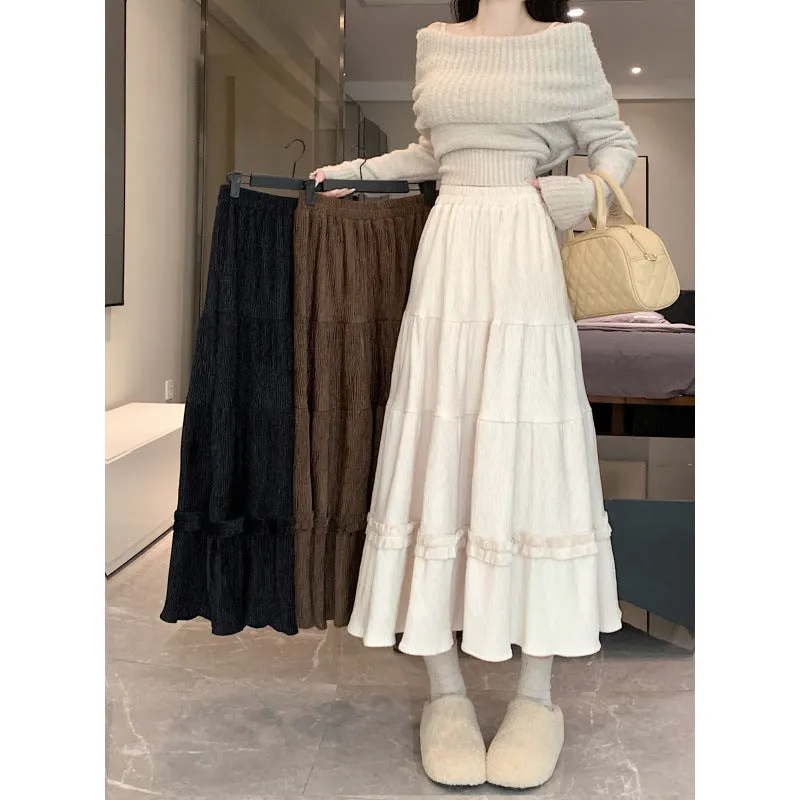Beige corduroy A-line midi skirt with elastic waistband on a hanger.