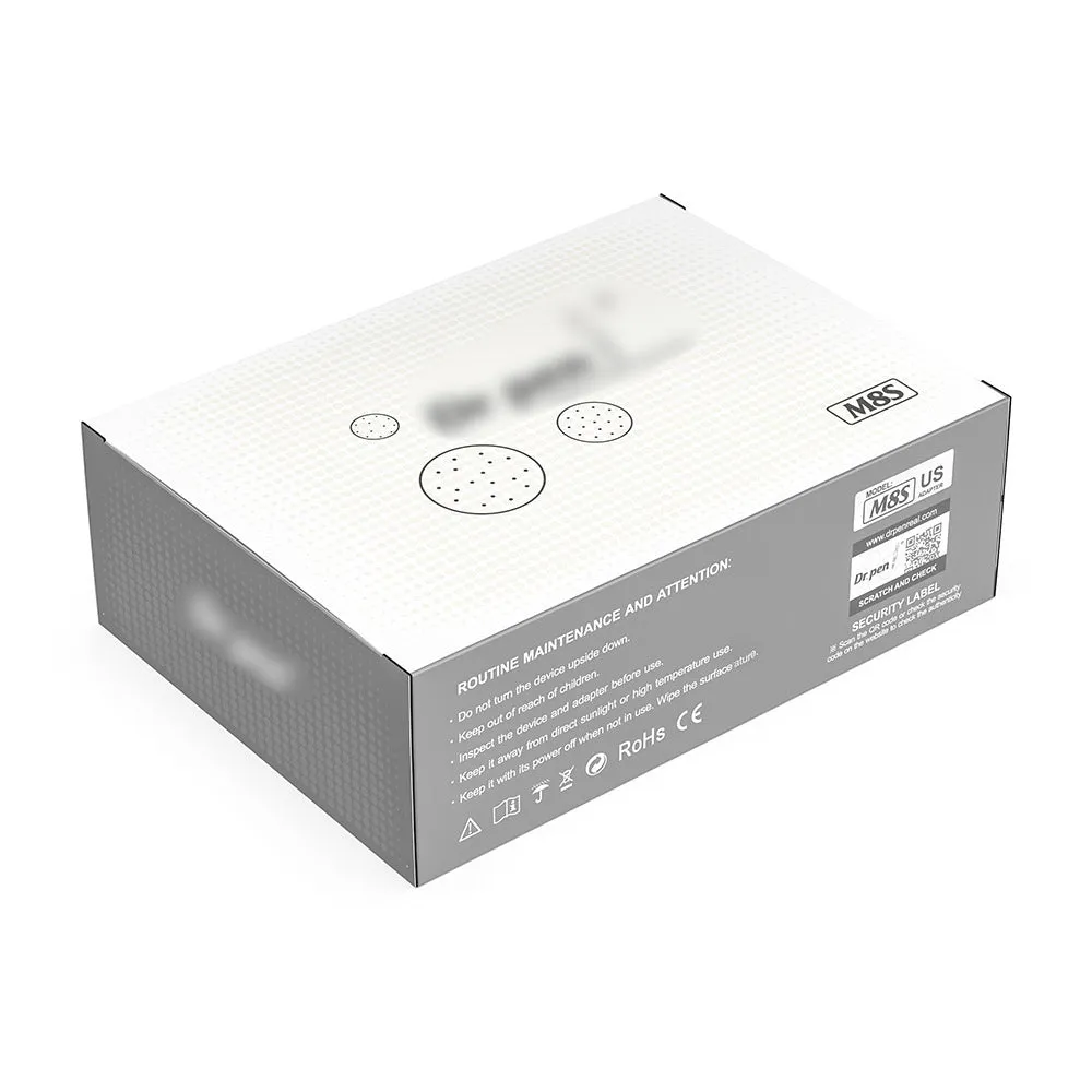 Grey wireless electric micro-needle pen with USB charging port lying on a flat surface
