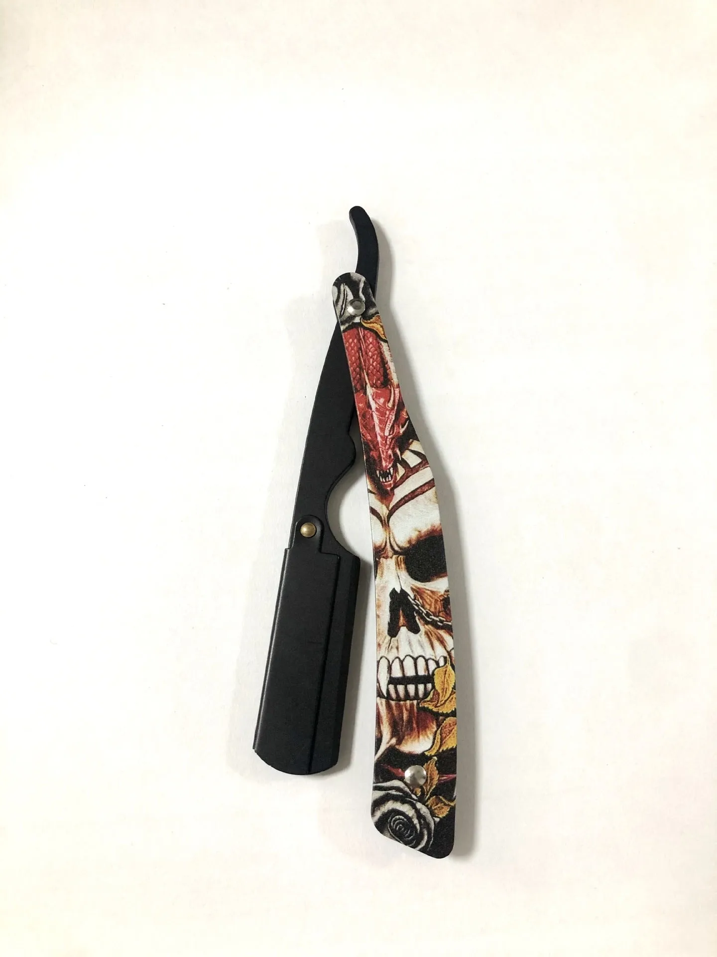 Clown Skull manual pogonotomy shaver with 74-blade and four colour pattern options