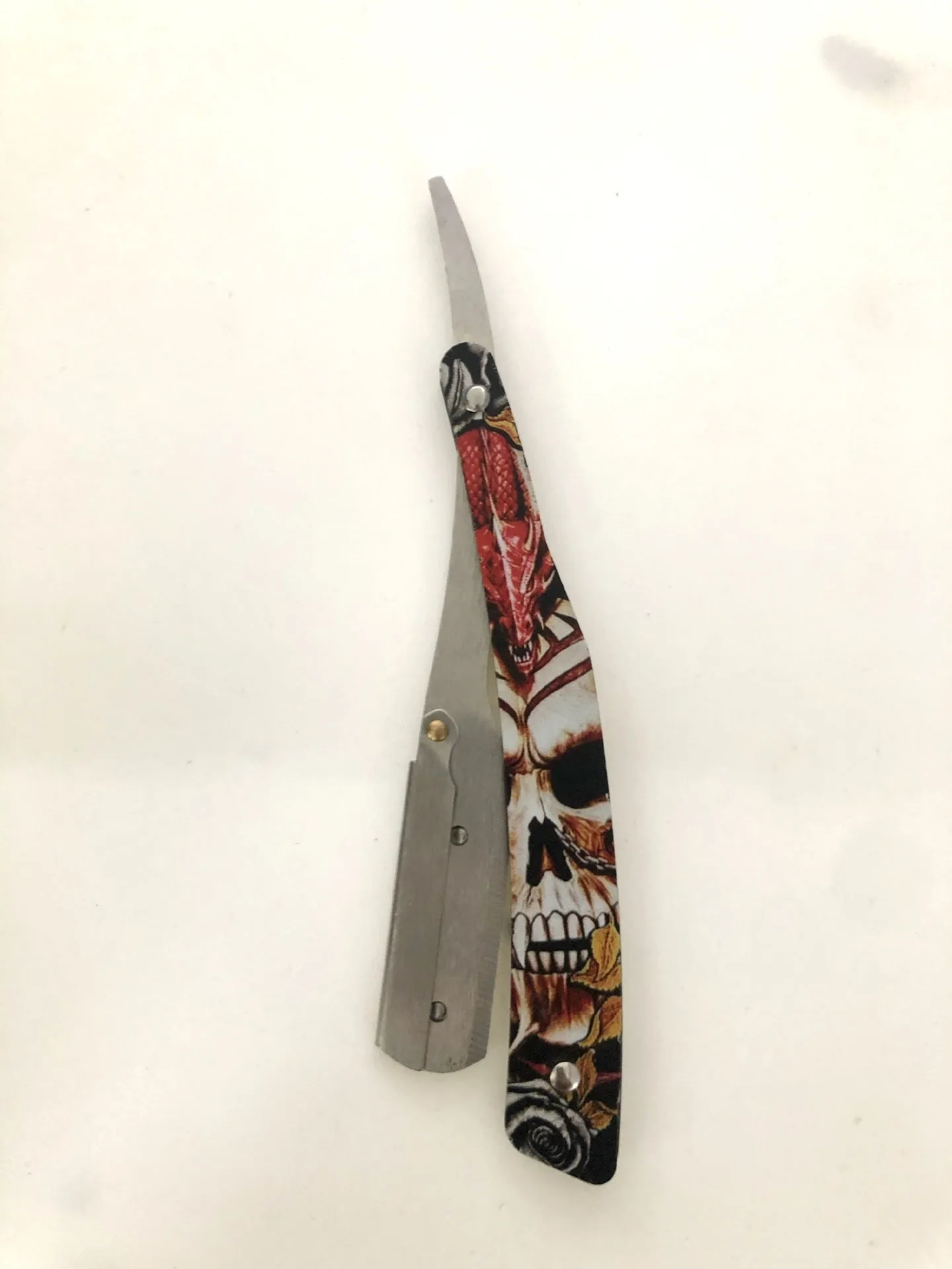 Clown Skull manual pogonotomy shaver with 74-blade and four colour pattern options