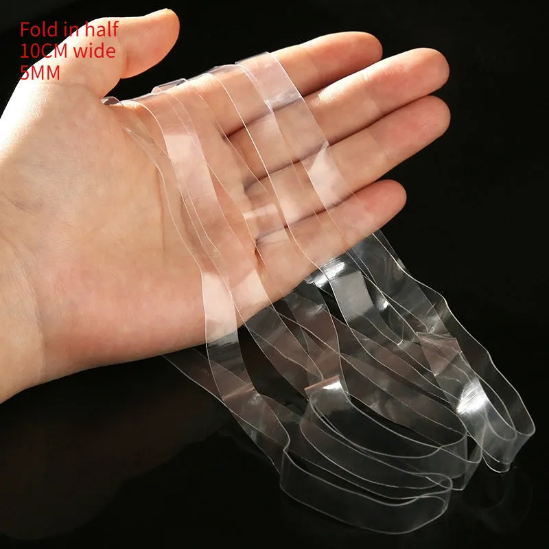 Transparent white TPU rubber bands of various sizes on a light surface