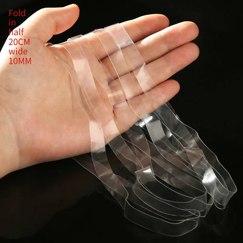 Transparent white TPU rubber bands of various sizes on a light surface