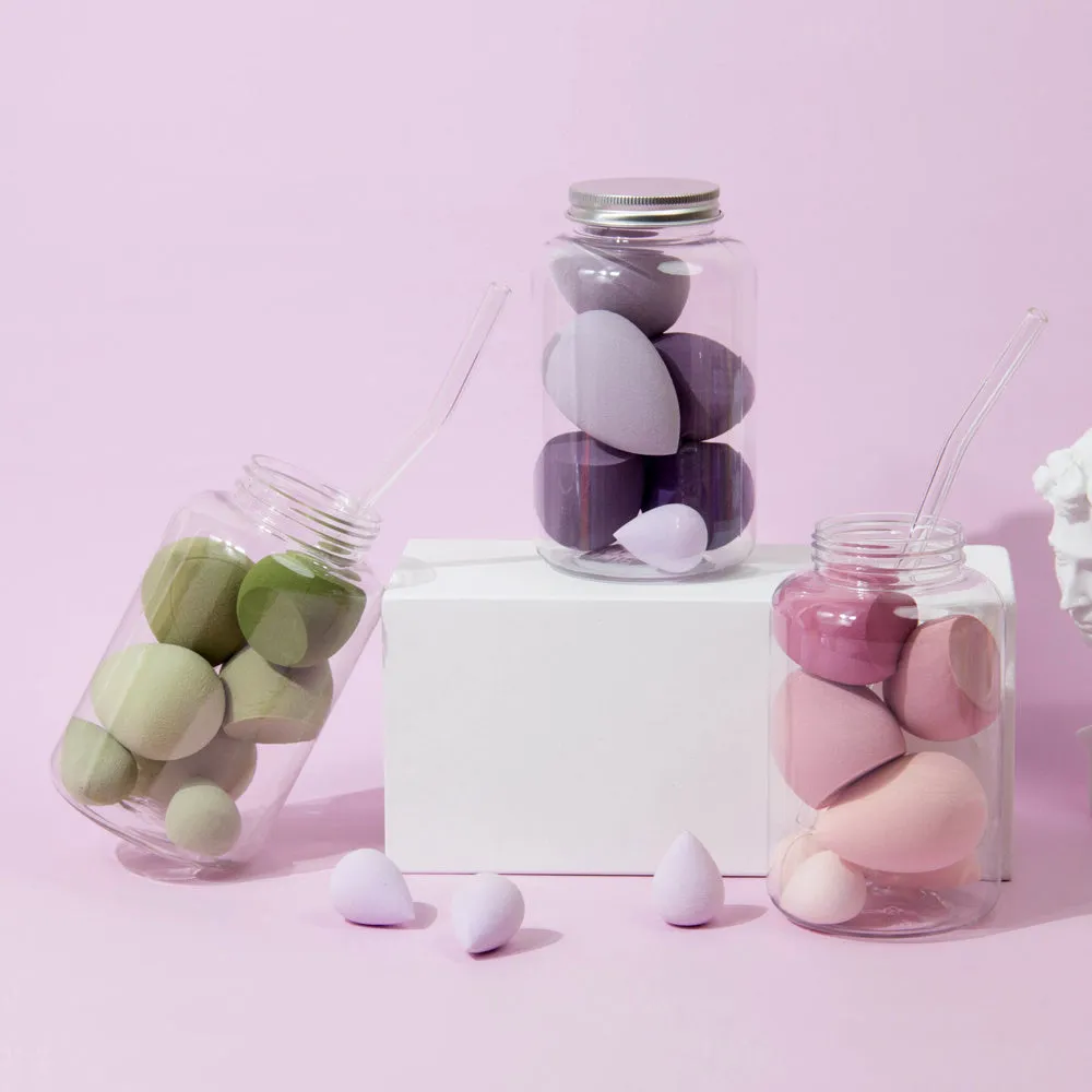 Set of 7 makeup sponge eggs in various colours inside transparent jar with multiple cut shapes