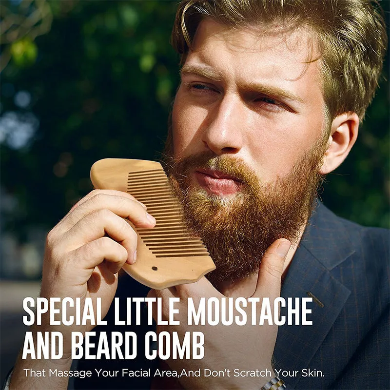 7-piece black beard grooming set with wood brush, metal comb, scissors, apron and cleaning brush on a surface