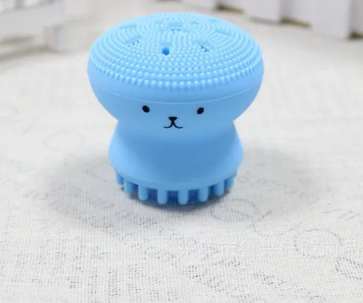 Cartoon octopus silicone wash brush in pink for manual facial cleansing and massage