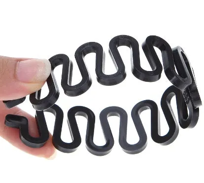 Set of three plastic hair styling tools: double hook needle, French braiding tool, and two pull hair needles on black background