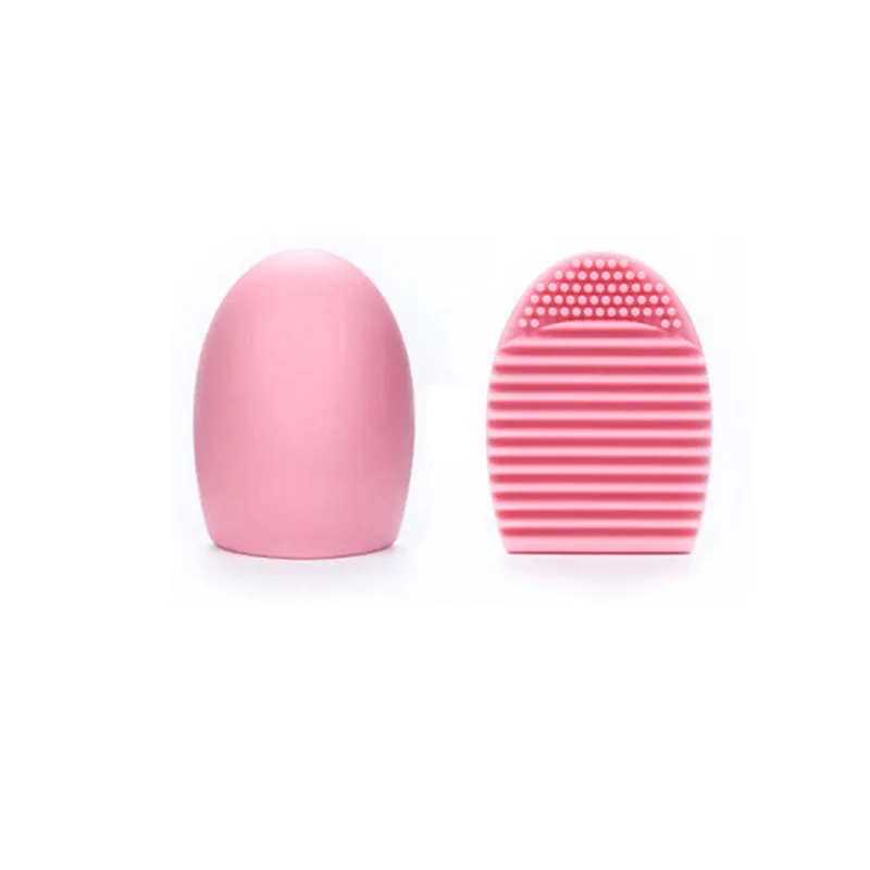 Silicone makeup brush wash egg in blue with top knobs and bottom grooves for cleaning bristles