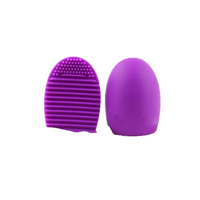 Silicone makeup brush wash egg in blue with top knobs and bottom grooves for cleaning bristles