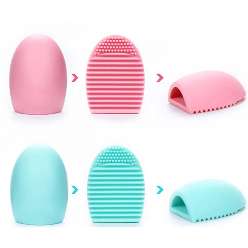 Silicone makeup brush wash egg in blue with top knobs and bottom grooves for cleaning bristles