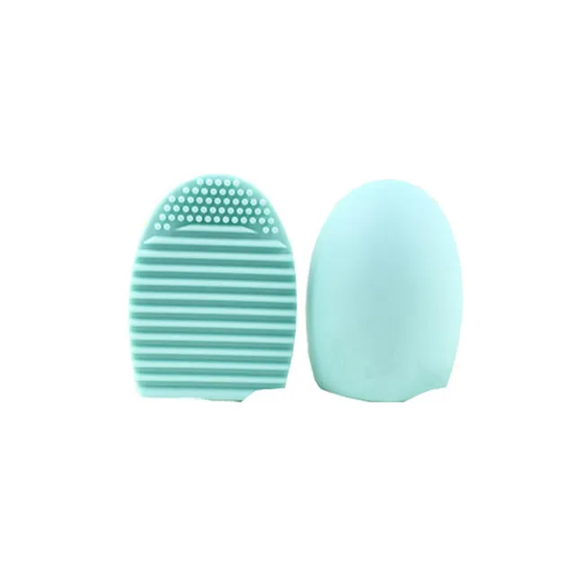 Silicone makeup brush wash egg in blue with top knobs and bottom grooves for cleaning bristles