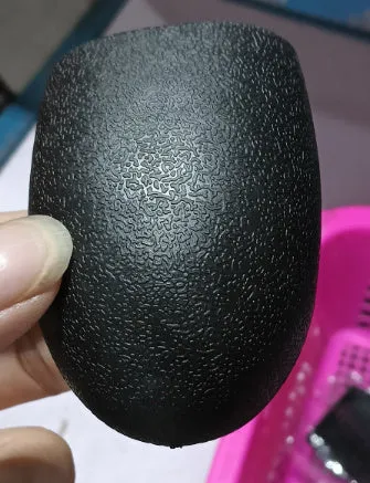 Silicone makeup brush wash egg in blue with top knobs and bottom grooves for cleaning bristles