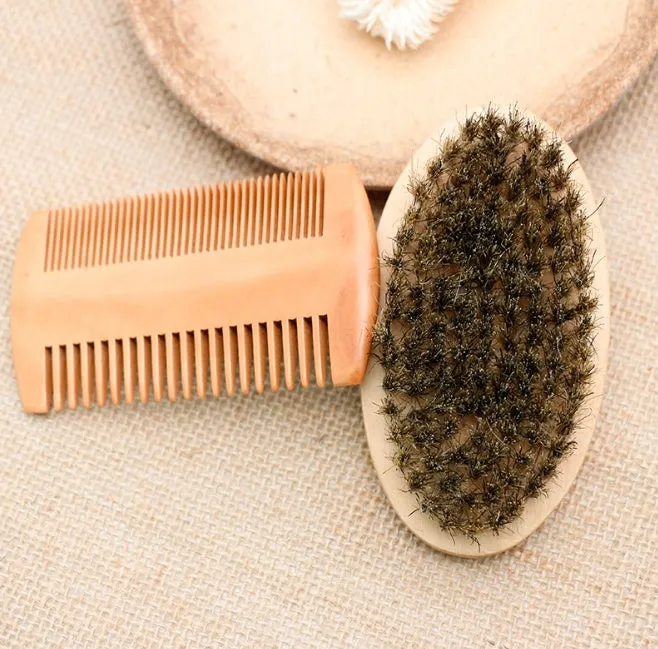 Men's beard care set with double-sided wooden comb and oval brush on light background