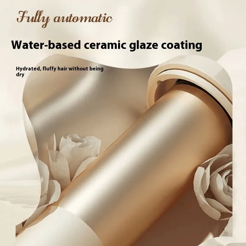 White and Chigo brand automatic hair curler with a 32mm barrel on a table.