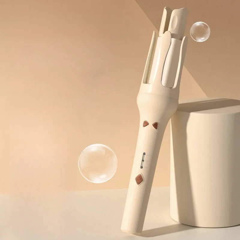 White and Chigo brand automatic hair curler with a 32mm barrel on a table.