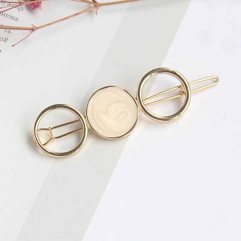 Round metal hairpin with opal crystal centre in beige colour, 7cm alloy construction