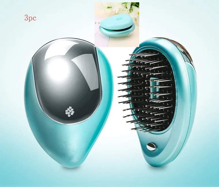 Pink electric sound wave vibration magnetic massage comb with ergonomic handle and negative ion function