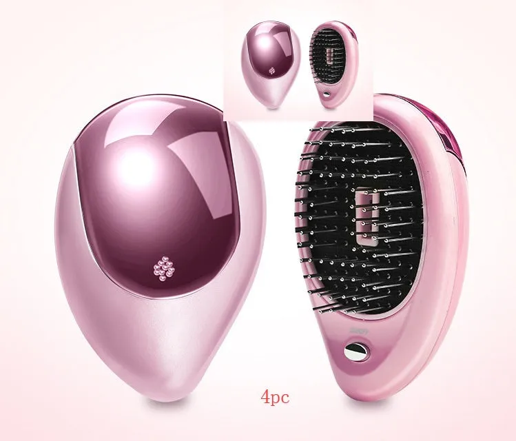 Pink electric sound wave vibration magnetic massage comb with ergonomic handle and negative ion function