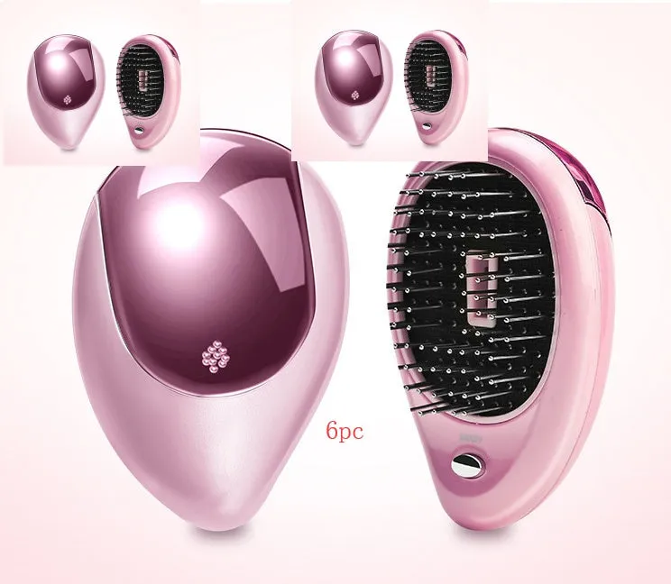 Pink electric sound wave vibration magnetic massage comb with ergonomic handle and negative ion function