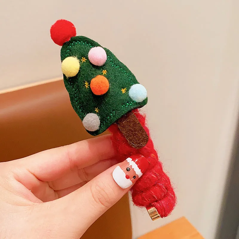 Children Christmas hair ties with red bell, green tree, khaki elk, and red tree designs on a light background