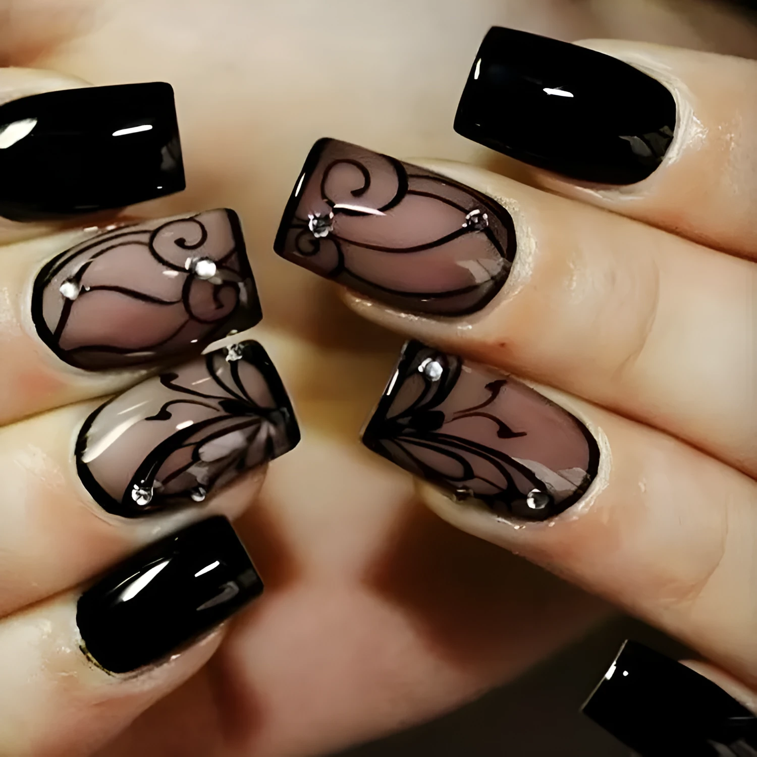 Dark Ins style black vine wearable nail tips set with jelly glue finish on a white background