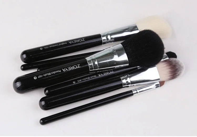 7-piece makeup brush set with synthetic and goat hair bristles and wood handles in green purple and red colours