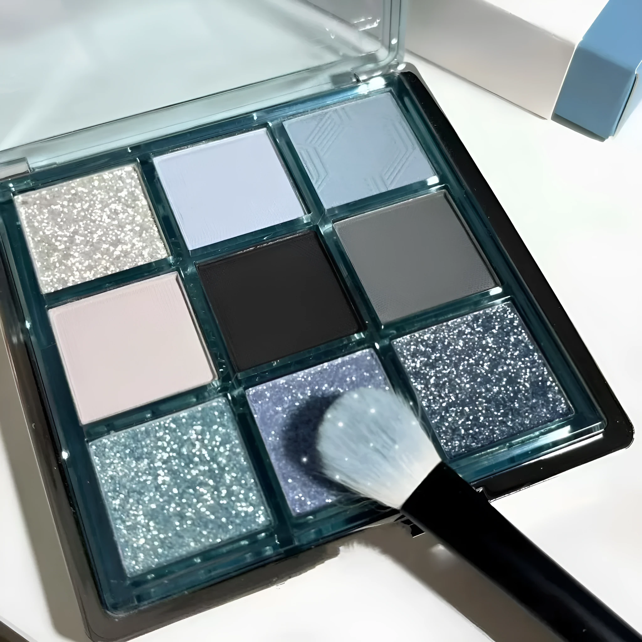 MUGELEEN 08 nine-colour eye shadow palette showing low saturation blues and earth tones