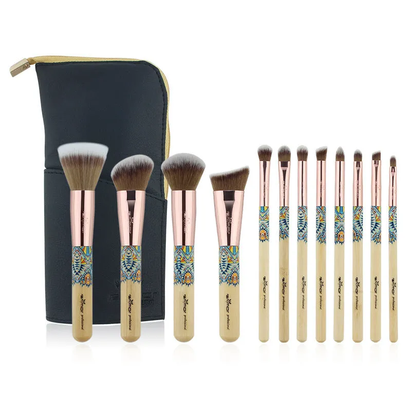12 makeup brushes with man-made fibre bristles and wooden handles, arranged on a flat surface