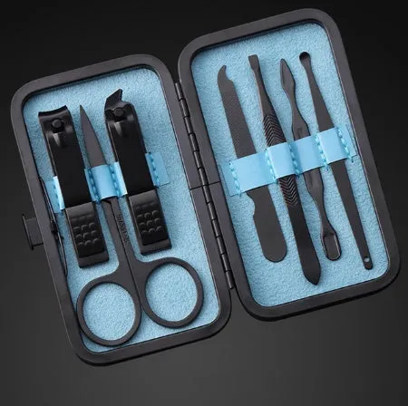 7-piece metal nail clippers manicure set with eyebrow scissors and nail file on white background