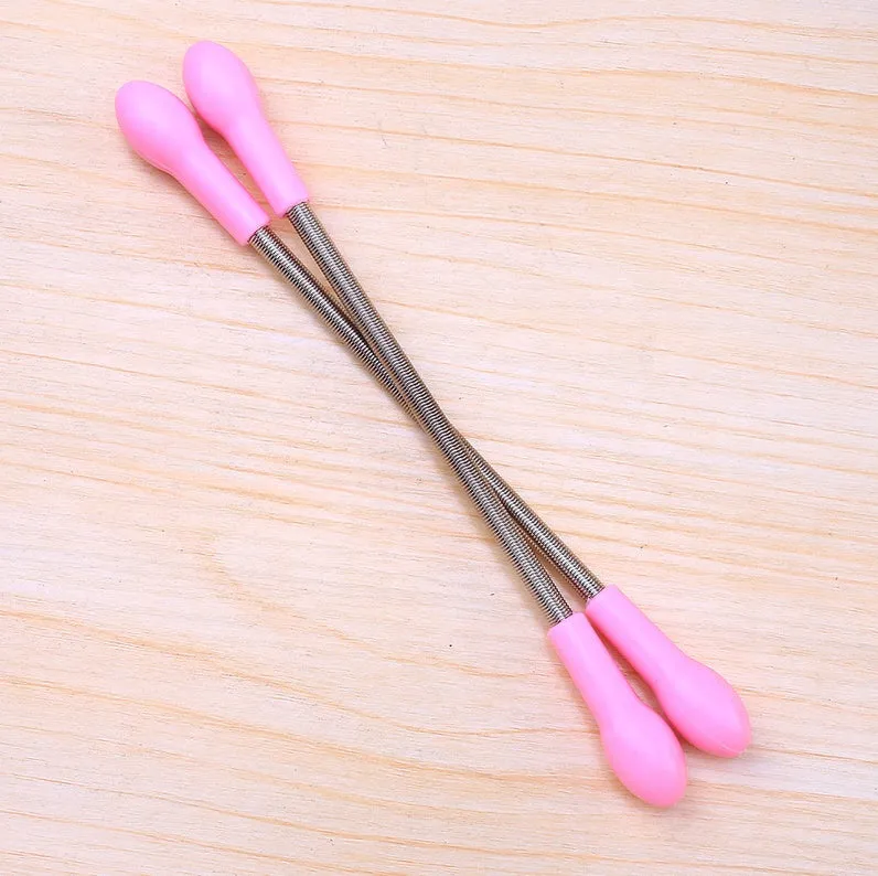 Pink facial hair remover with stainless steel spring and plastic handles, 19cm long, on a light background