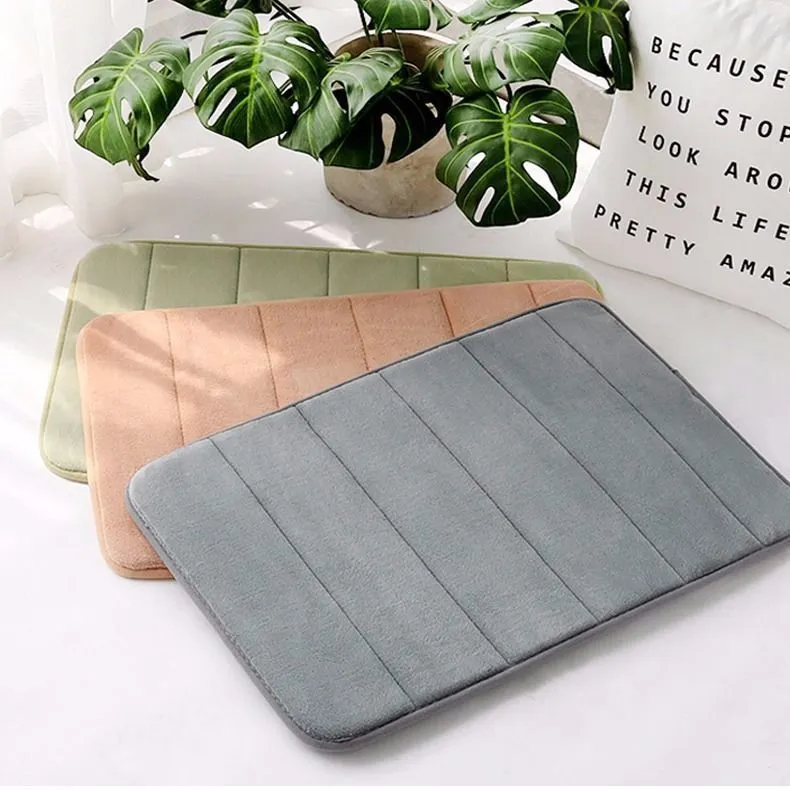 Coral fleece non-slip bath mat in 40x60cm size, placed on bathroom floor with water absorbent surface