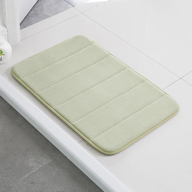 Coral fleece non-slip bath mat in 40x60cm size, placed on bathroom floor with water absorbent surface
