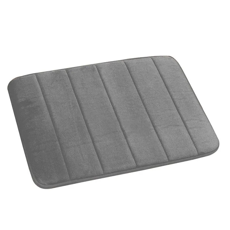 Coral fleece non-slip bath mat in 40x60cm size, placed on bathroom floor with water absorbent surface
