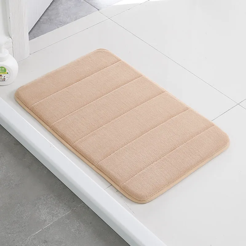 Coral fleece non-slip bath mat in 40x60cm size, placed on bathroom floor with water absorbent surface