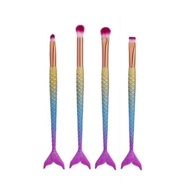 10 mermaid makeup brushes with multicolour nylon bristles and plastic handles laid flat