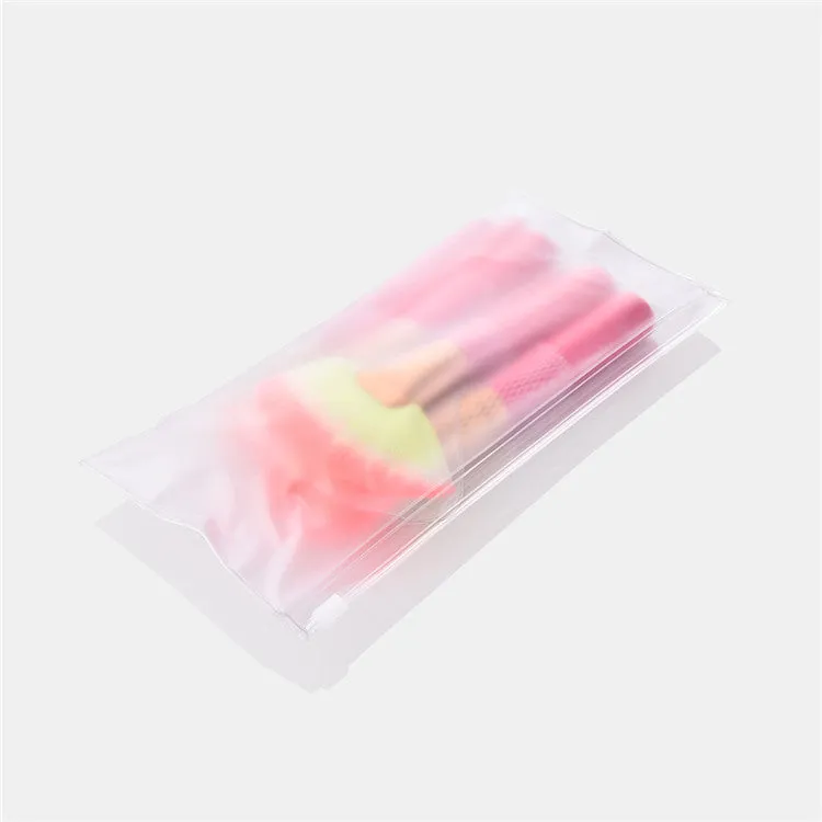 Pink wooden handle synthetic bristle makeup brush set in a compact case