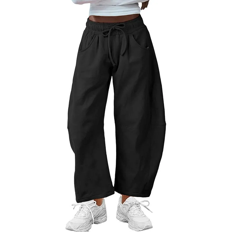 Women's loose cropped sweatpants in cotton fabric with elastic drawstring waistband in street fashion styling
