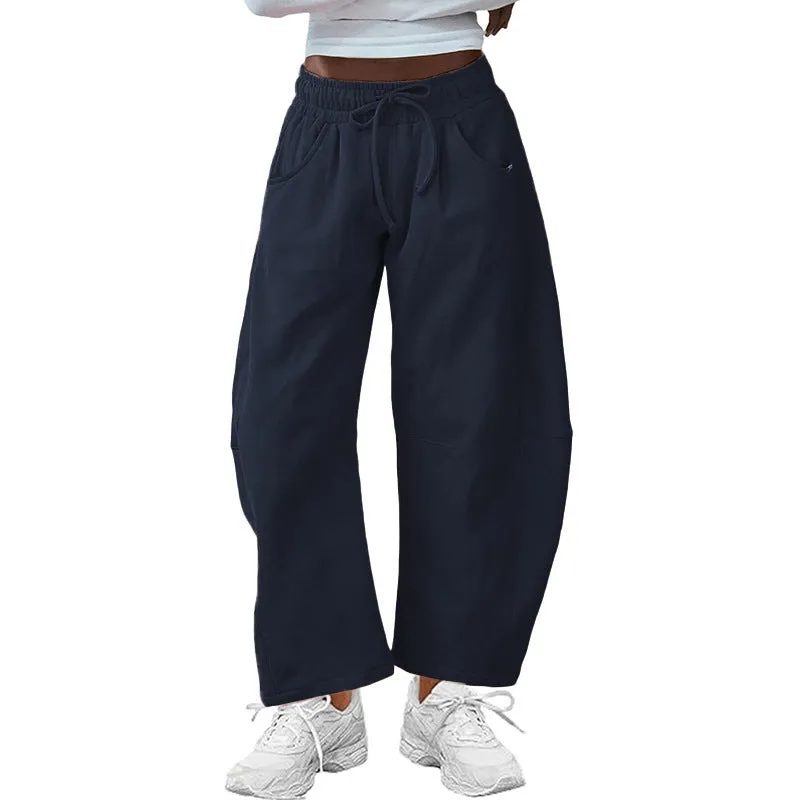 Women's loose cropped sweatpants in cotton fabric with elastic drawstring waistband in street fashion styling