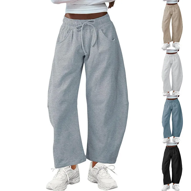 Women's loose cropped sweatpants in cotton fabric with elastic drawstring waistband in street fashion styling