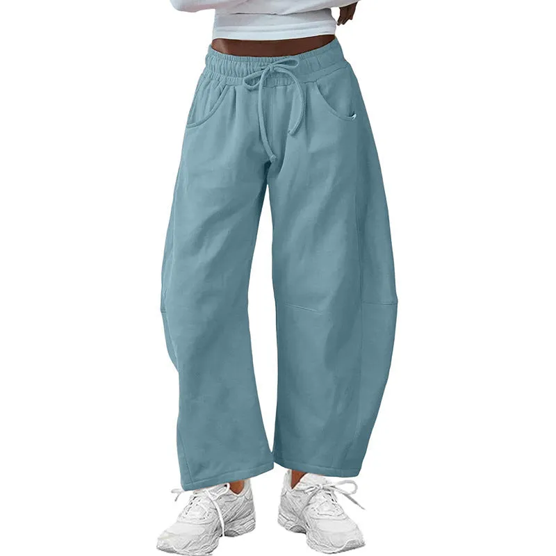 Women's loose cropped sweatpants in cotton fabric with elastic drawstring waistband in street fashion styling