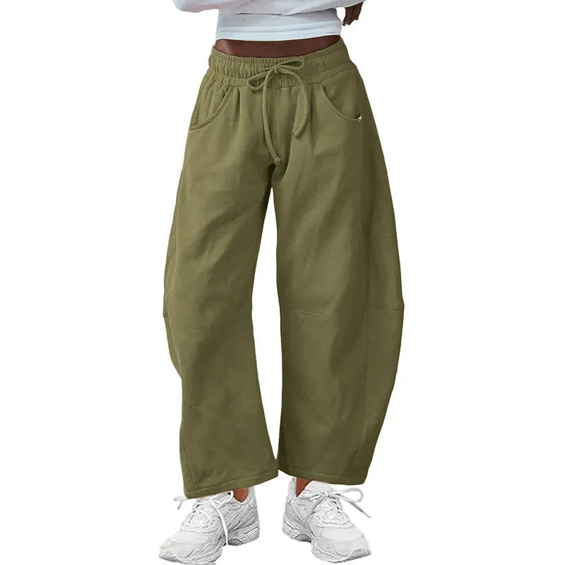 Women's loose cropped sweatpants in cotton fabric with elastic drawstring waistband in street fashion styling