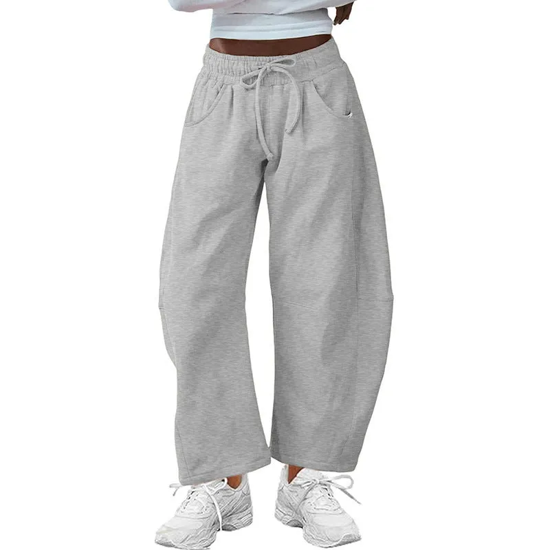 Women's loose cropped sweatpants in cotton fabric with elastic drawstring waistband in street fashion styling