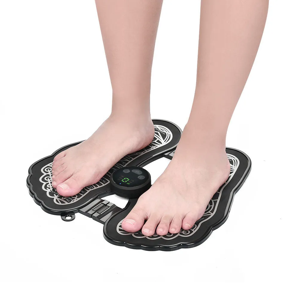 Black rechargeable foldable EMS foot massager pad with control host on floor