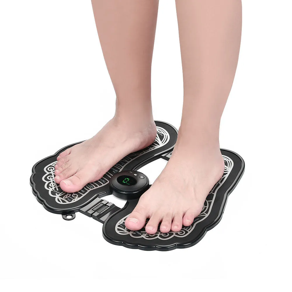 Black rechargeable foldable EMS foot massager pad with control host on floor