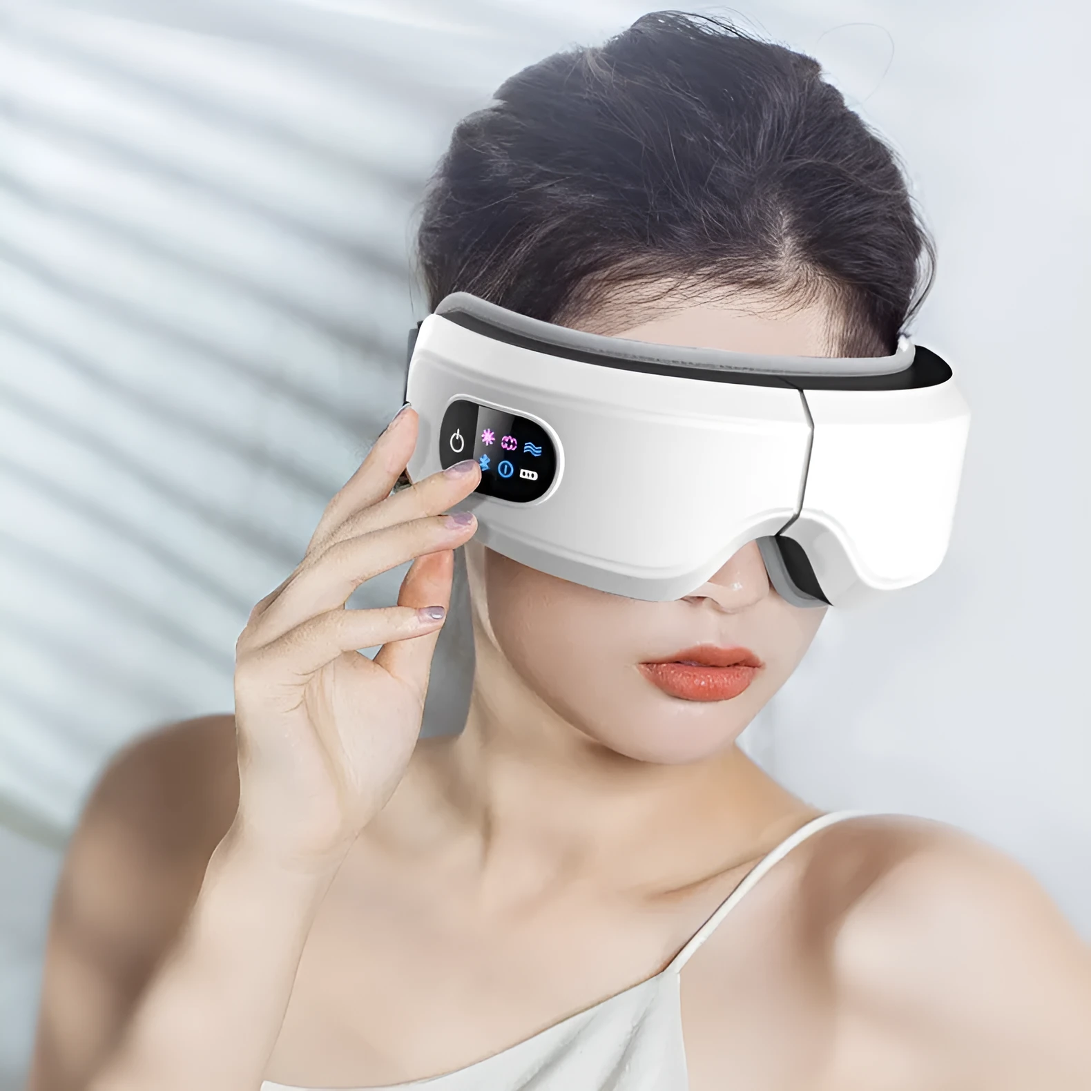 White eye massager with air pressure, hot compress, and vibration functions, USB-powered, with Bluetooth music