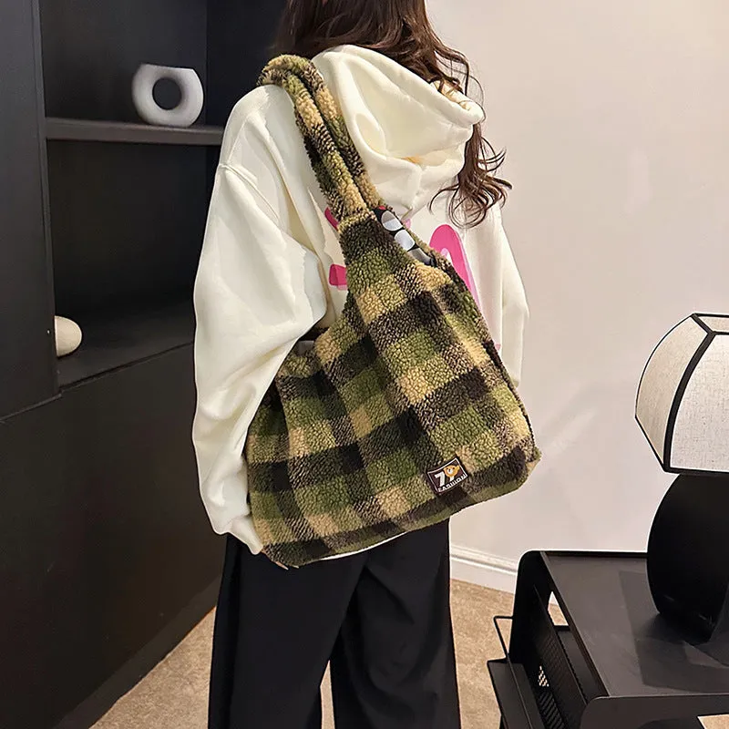 Women's plaid plush crossbody tote bag showing large capacity interior with zipper compartments