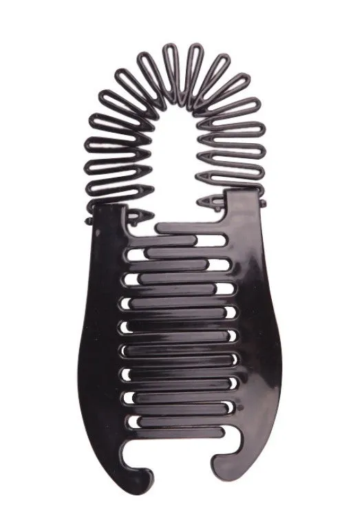 Retro fish-shaped hair claw clip in black with metal accents and adjustable hairband on a flat surface