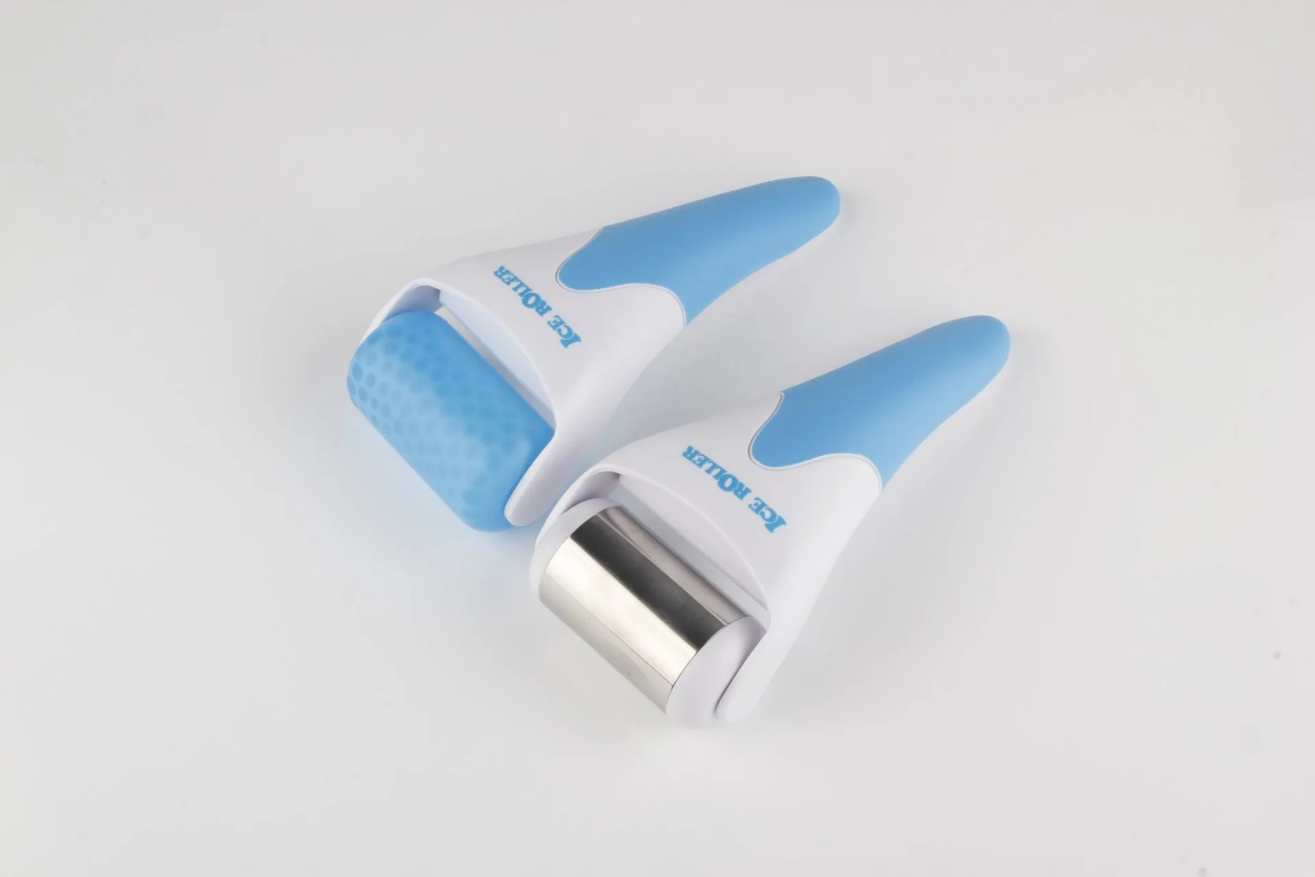 Plastic ice roller face roller in blue with removable head on white background