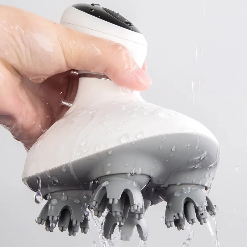 White rechargeable waterproof electric scalp head massager with wireless remote control on a surface