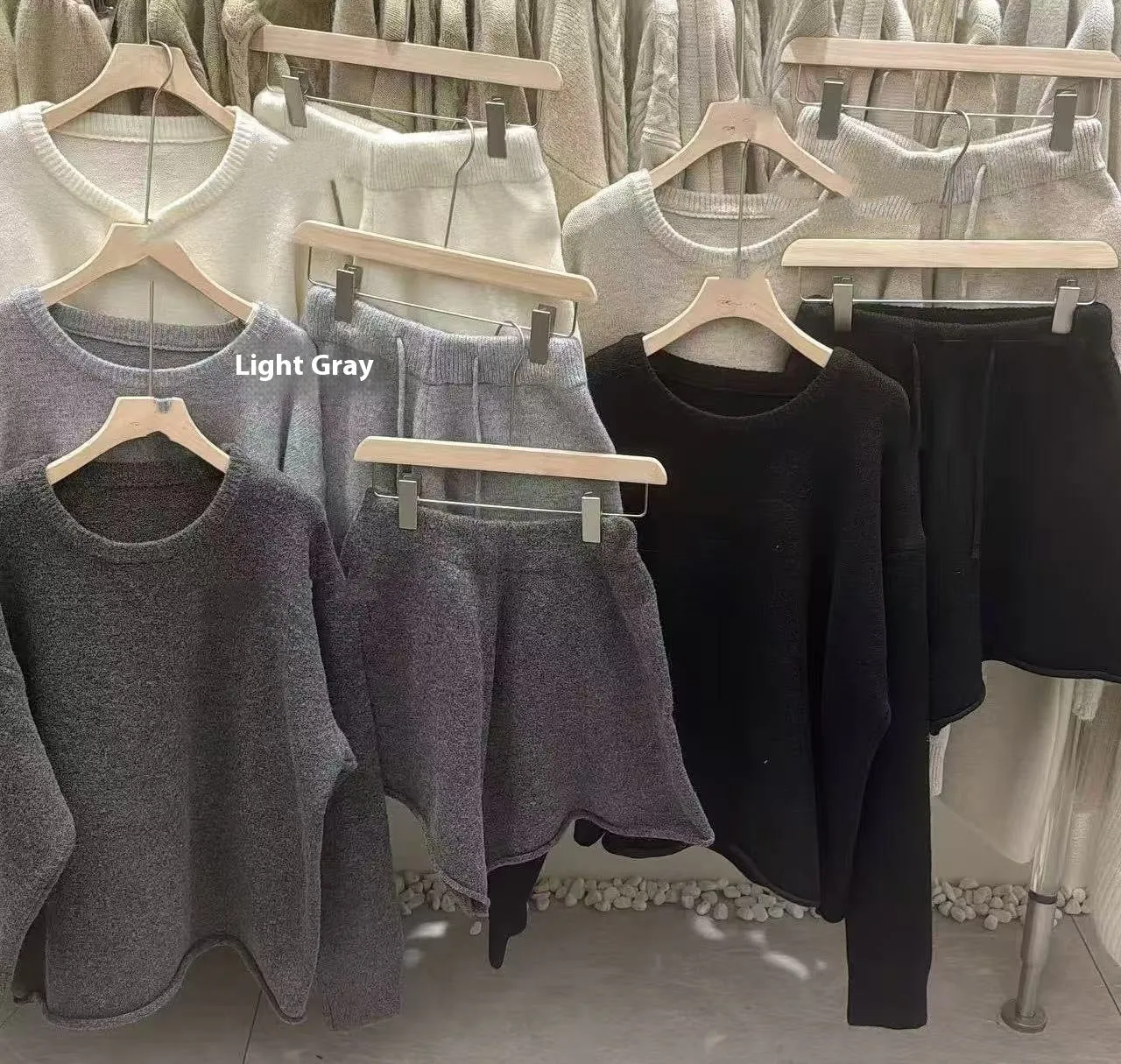 Women's knitted loose-fitting sweater and wide-leg shorts two-piece set in a neutral colour.