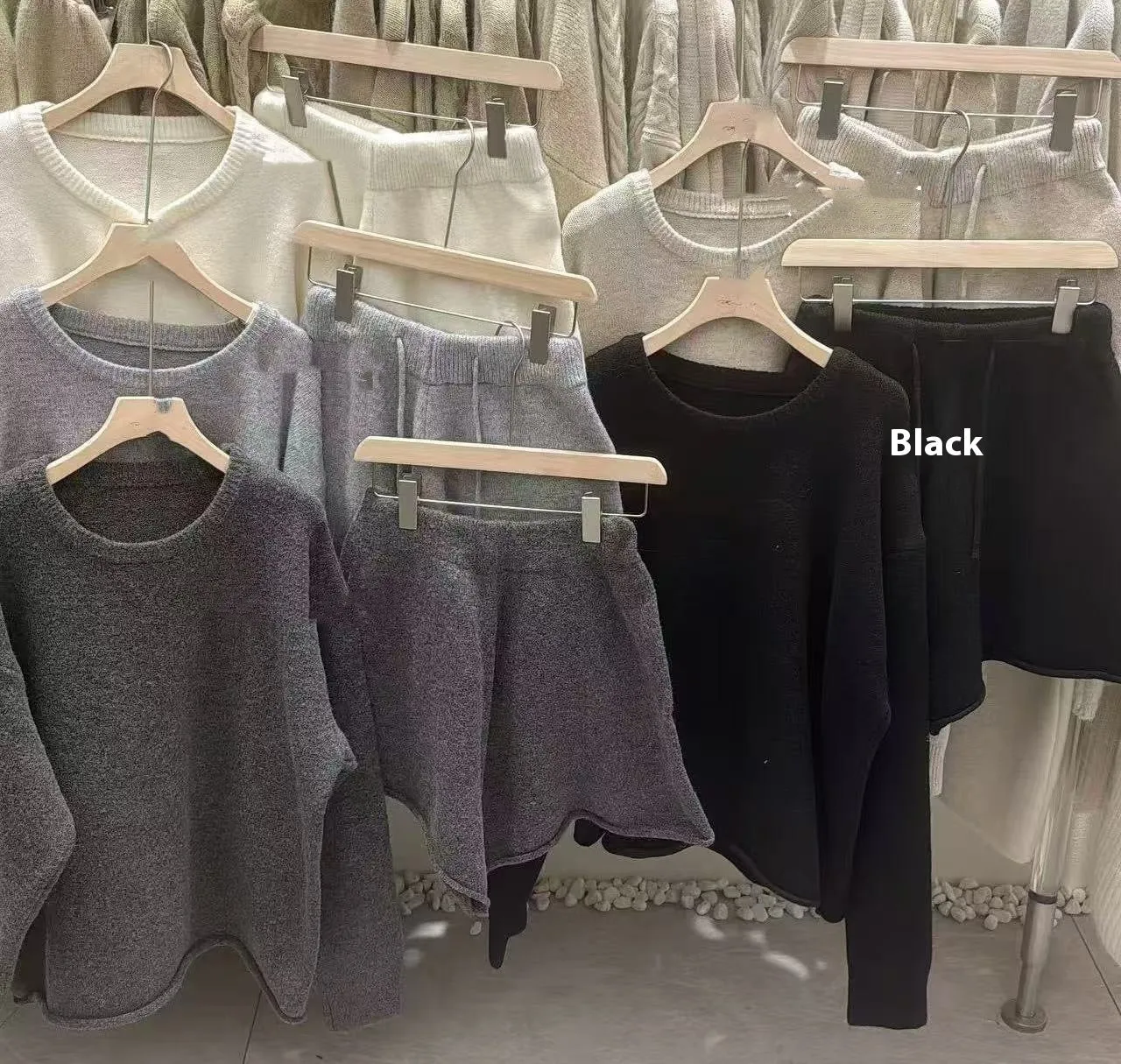 Women's knitted loose-fitting sweater and wide-leg shorts two-piece set in a neutral colour.